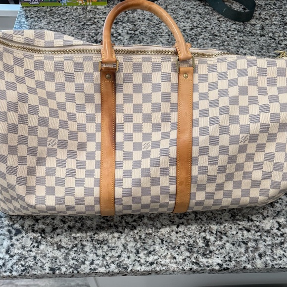 Louis Vuitton duffle bag, two of the straps are damaged as shown in pictures. - Picture 6 of 15